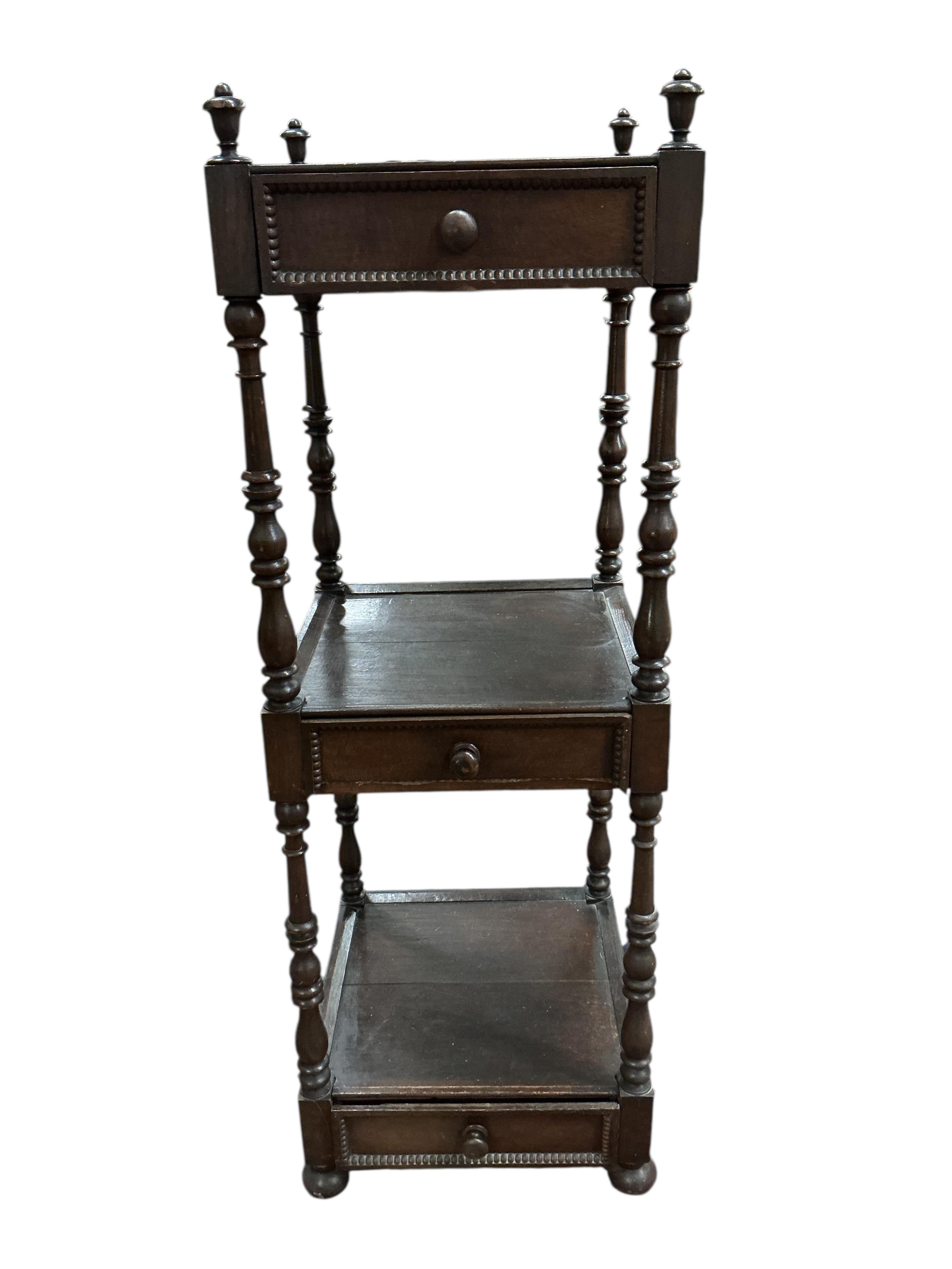 A Regency style oak three tier whatnot, width 46cm, height 136cm